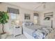 Guest bedroom with water views and white wicker furniture at 4900 Brittany S Dr # 701, St Petersburg, FL 33715