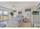 Bedroom with water views and white wicker furniture at 4900 Brittany S Dr # 701, St Petersburg, FL 33715
