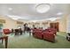 Comfortable community room with plush seating and a green carpet at 4900 Brittany S Dr # 701, St Petersburg, FL 33715