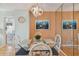 Charming dining area with glass table and four chairs at 4900 Brittany S Dr # 701, St Petersburg, FL 33715