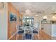 Bright dining room with glass-top table and kitchen views at 4900 Brittany S Dr # 701, St Petersburg, FL 33715