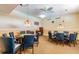 Well-lit game room with two card tables and chairs at 4900 Brittany S Dr # 701, St Petersburg, FL 33715
