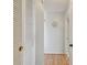 Hallway with light walls and wood flooring at 4900 Brittany S Dr # 701, St Petersburg, FL 33715