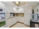 Well-equipped kitchen with white cabinets and modern appliances at 4900 Brittany S Dr # 701, St Petersburg, FL 33715