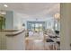 Bright living room with water views and access to balcony at 4900 Brittany S Dr # 701, St Petersburg, FL 33715