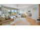 Living room with striped couches, coffee table, and view of bedroom at 4900 Brittany S Dr # 701, St Petersburg, FL 33715