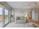 Living room with balcony access and ocean views at 4900 Brittany S Dr # 701, St Petersburg, FL 33715
