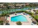 Community pool with lounge chairs and tropical landscaping at 4900 Brittany S Dr # 701, St Petersburg, FL 33715