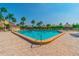 Clean and refreshing community pool with thatched umbrellas at 4900 Brittany S Dr # 701, St Petersburg, FL 33715
