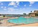 Inviting community pool with waterfront views and ample deck space at 4900 Brittany S Dr # 701, St Petersburg, FL 33715