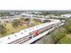 Aerial view highlighting a condo building with surrounding landscape and parking at 4920 Locust Ne St # 116, St Petersburg, FL 33703