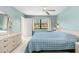 Spacious bedroom with a ceiling fan and large window at 4920 Locust Ne St # 116, St Petersburg, FL 33703