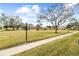 Community view showing landscaping and trees at 4920 Locust Ne St # 116, St Petersburg, FL 33703