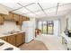 Efficient kitchen with white appliances and wood cabinets at 4920 Locust Ne St # 116, St Petersburg, FL 33703