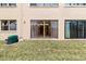 Ground level patio access with grassy area at 4920 Locust Ne St # 116, St Petersburg, FL 33703