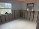 Unfinished bedroom with window and damaged walls at 4933 Venetian Ne Blvd, St Petersburg, FL 33703