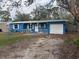 Blue ranch style home with attached garage at 4933 Venetian Ne Blvd, St Petersburg, FL 33703