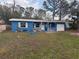 Ranch style home with blue exterior and carport at 4933 Venetian Ne Blvd, St Petersburg, FL 33703