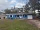 Cute blue house with carport and small front yard at 4933 Venetian Ne Blvd, St Petersburg, FL 33703