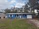 Cute blue house with carport and small front yard at 4933 Venetian Ne Blvd, St Petersburg, FL 33703