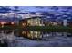 Modern community center with pond reflection at dusk at 5289 Everlong Dr, Apollo Beach, FL 33572