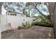 Landscaped backyard with shed and seating area at 5309 21St S Ave, Gulfport, FL 33707