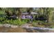 Quaint purple house with a landscaped front yard at 5309 21St S Ave, Gulfport, FL 33707