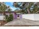 Purple house with a white fence and landscaping at 5309 21St S Ave, Gulfport, FL 33707