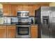 Kitchen with stainless steel appliances and wood cabinets at 5309 21St S Ave, Gulfport, FL 33707