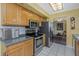 Kitchen with stainless steel appliances and wood cabinets at 5309 21St S Ave, Gulfport, FL 33707