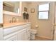 Bathroom with vanity, toilet and shower at 5581 Salem Square S Dr, Palm Harbor, FL 34685