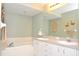 Double vanity, bathtub, and separate shower at 5581 Salem Square S Dr, Palm Harbor, FL 34685