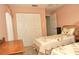 Bedroom with two twin beds and built-in closet at 5581 Salem Square S Dr, Palm Harbor, FL 34685