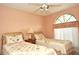 Two twin beds, dresser, and arched window at 5581 Salem Square S Dr, Palm Harbor, FL 34685