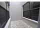 Small gravel courtyard with two windows at 5581 Salem Square S Dr, Palm Harbor, FL 34685