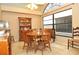 Bright dining area with a round table and large window at 5581 Salem Square S Dr, Palm Harbor, FL 34685