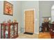 Bright entryway with hardwood floors and decorative accents at 5581 Salem Square S Dr, Palm Harbor, FL 34685