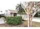 Front view of charming house with two car garage at 5581 Salem Square S Dr, Palm Harbor, FL 34685