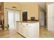 Kitchen island with granite countertop and white cabinetry at 5581 Salem Square S Dr, Palm Harbor, FL 34685