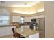 Spacious kitchen with island, stainless steel appliances, and granite countertops at 5581 Salem Square S Dr, Palm Harbor, FL 34685