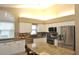 Eat-in kitchen with granite island and stainless steel appliances at 5581 Salem Square S Dr, Palm Harbor, FL 34685