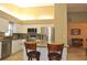 Open kitchen boasts island seating and stainless steel appliances at 5581 Salem Square S Dr, Palm Harbor, FL 34685