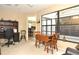Bright office features built-in desk and view to kitchen at 5581 Salem Square S Dr, Palm Harbor, FL 34685