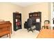 Spacious home office with ample desk space and shelving at 5581 Salem Square S Dr, Palm Harbor, FL 34685