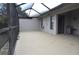 Large screened patio with access from sliding doors at 5581 Salem Square S Dr, Palm Harbor, FL 34685