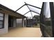 Covered patio with view of the backyard at 5581 Salem Square S Dr, Palm Harbor, FL 34685