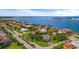 Aerial view showcasing a waterfront community with luxurious homes and stunning water views at 608 Columbus Dr, Tierra Verde, FL 33715