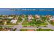 Aerial view of a waterfront neighborhood, highlighting the beautiful homes and landscaping at 608 Columbus Dr, Tierra Verde, FL 33715