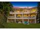 Luxury two-story home with a large backyard, patio, and fire pit for outdoor enjoyment at 608 Columbus Dr, Tierra Verde, FL 33715