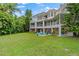 Two-story home with a large backyard, spacious patio, and fire pit at 608 Columbus Dr, Tierra Verde, FL 33715